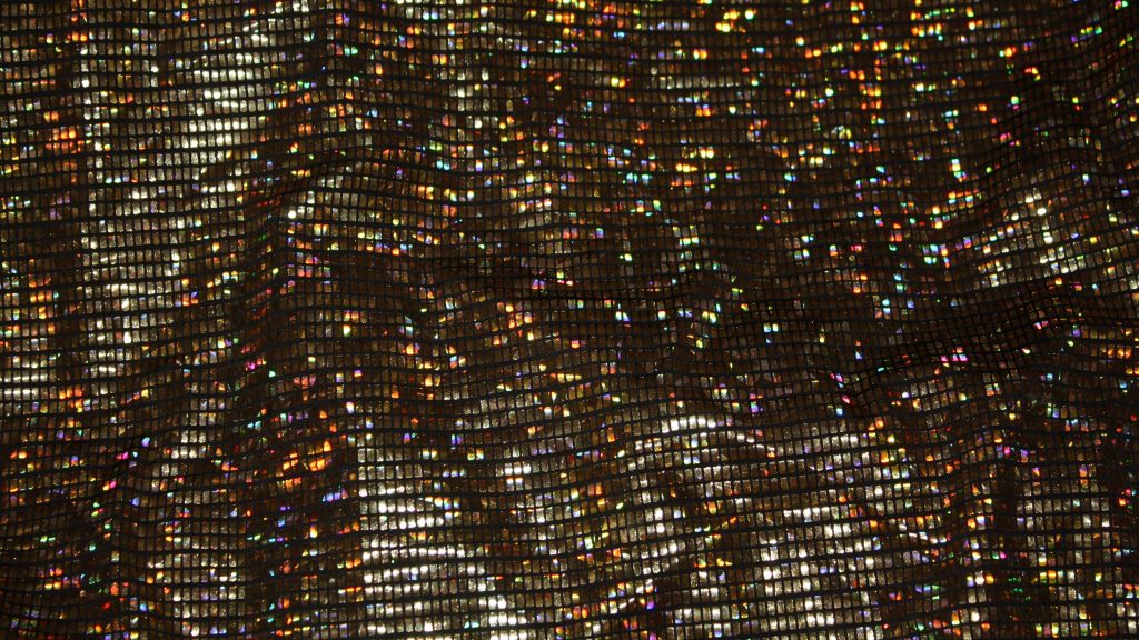 Holographic fabric texture with dark mesh grid and shimmering rainbow gold metallic elements wallpaper