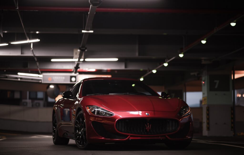 Maserati GranTurismo: Luxurious Front View in Elegance Garage Wallpaper