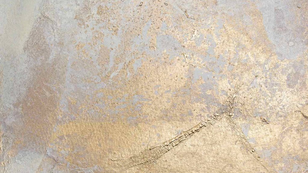 Elegant metallic gold paint on textured light gray wallpaper with abstract cracked pattern background