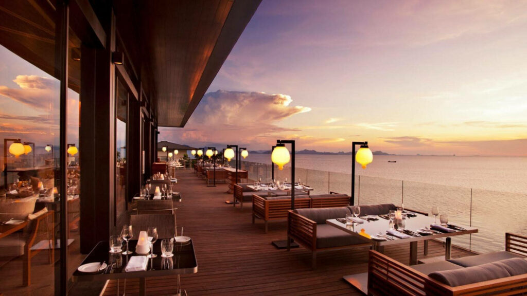 Serene Open-Air Dining at Conrad Koh Samui: Elegant Ocean Sunset View Wallpaper