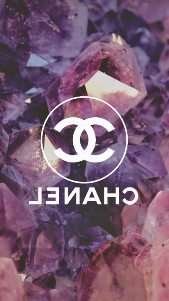 Inverted white Chanel logo on sparkling pink and purple crystal background luxury wallpaper