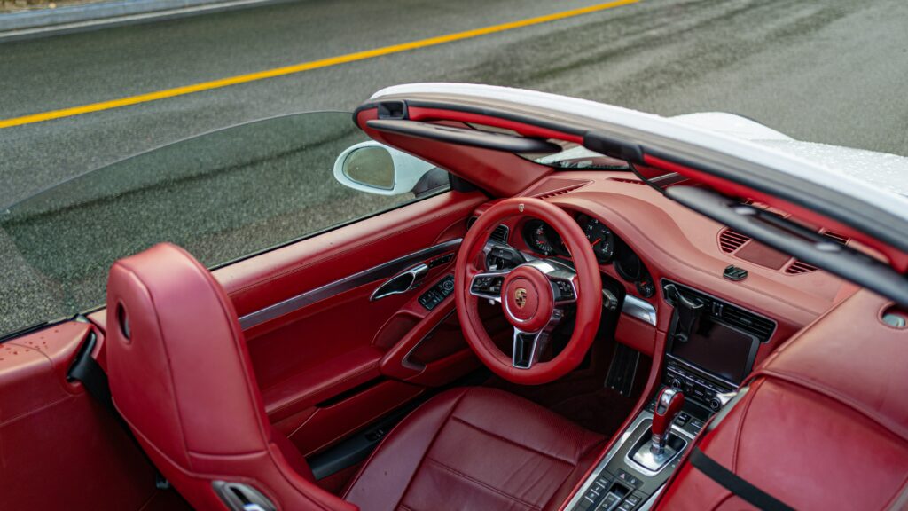 Luxurious Porsche Convertible Interior with Red Leather Elegance Wallpaper