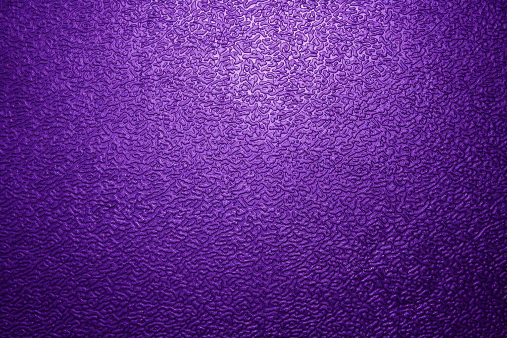 Luxurious Purple Textured Wallpaper with Intricate Patterns