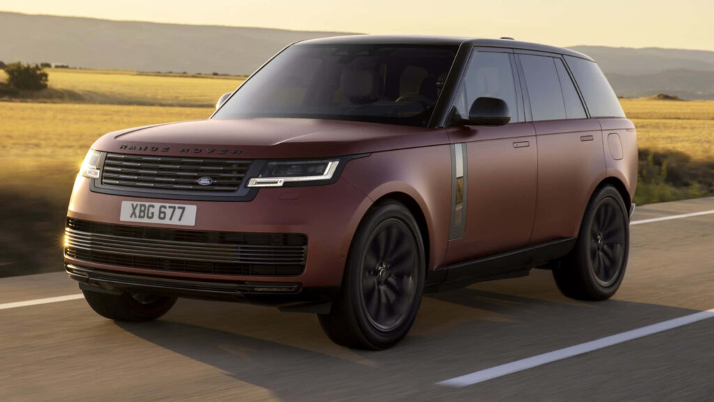 Luxurious Range Rover Wallpaper: Sleek Design in Golden Landscape