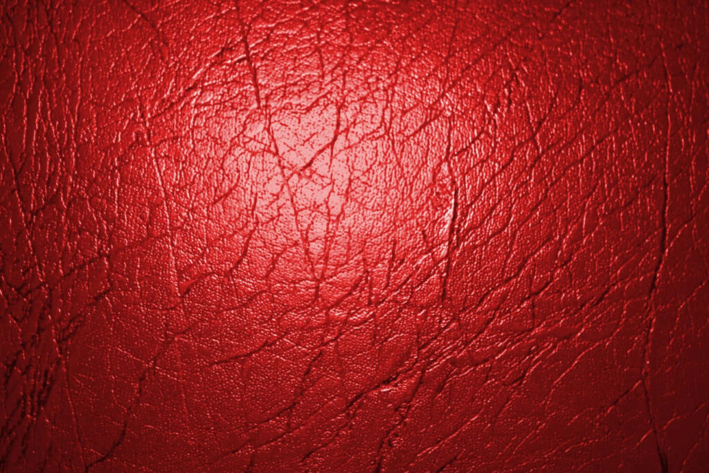 Luxurious Red Leather Texture Wallpaper with Natural Grain Patterns