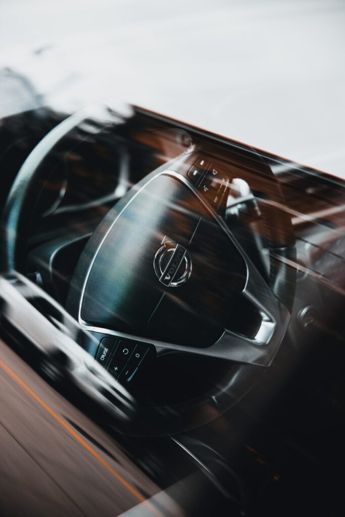 Luxurious Volvo Steering Wheel Close-Up: Sleek Modern Car Interior Wallpaper