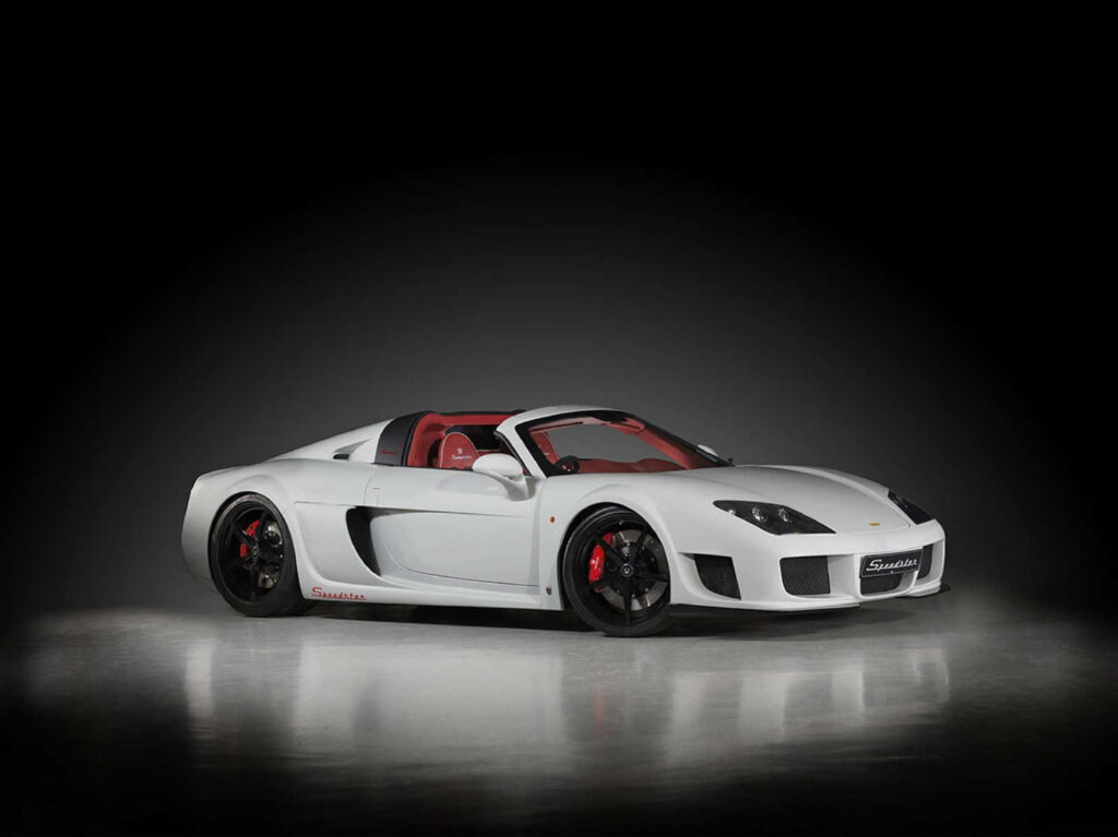 Luxurious white sports car with bold red interior on exhibition floor dramatic lighting wallpaper