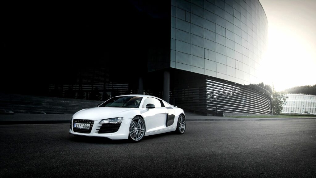 Sleek White Audi R8: Luxury Scene with Modern Glass Building Wallpaper