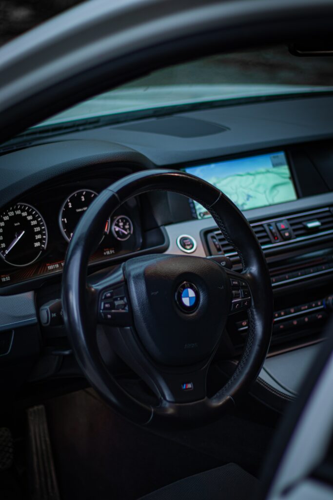 Elegant BMW Interior Wallpaper: Steering Wheel & Dashboard Design