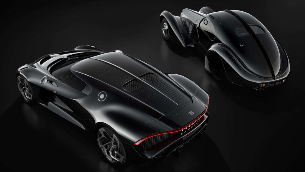 Two luxurious black Bugatti cars with sleek design on dark backdrop high-end automotive wallpaper