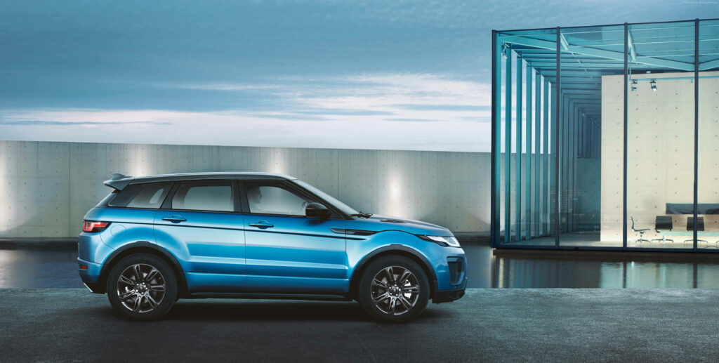 Luxurious Blue Range Rover 4K Wallpaper in Modern Office Setting