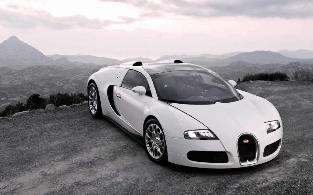 Sleek White Bugatti Veyron in Scenic Mountain Background Wallpaper