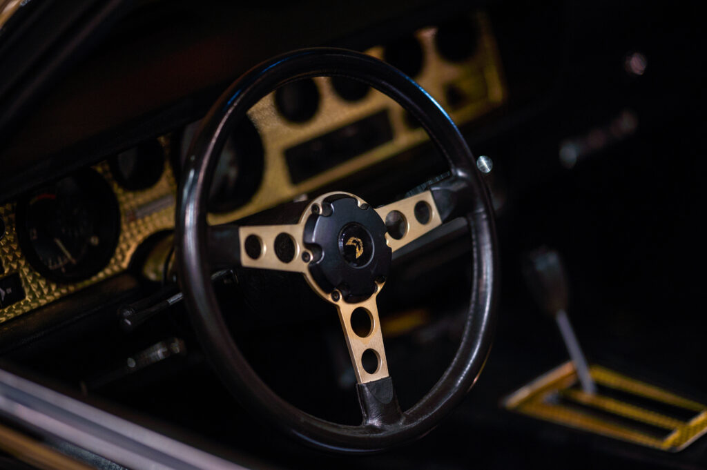 Luxury Black Metallic Steering Wheel & Dashboard High-Res Wallpaper