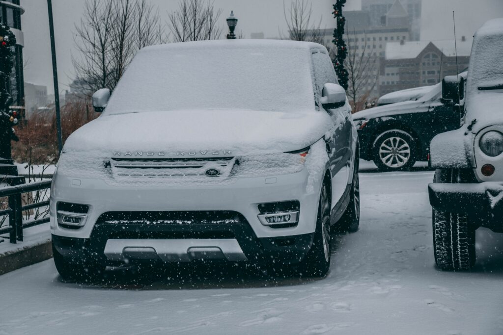 Luxury Land Rover Range Rover in Snowy Elegance - Stunning SUV Scene Wallpaper