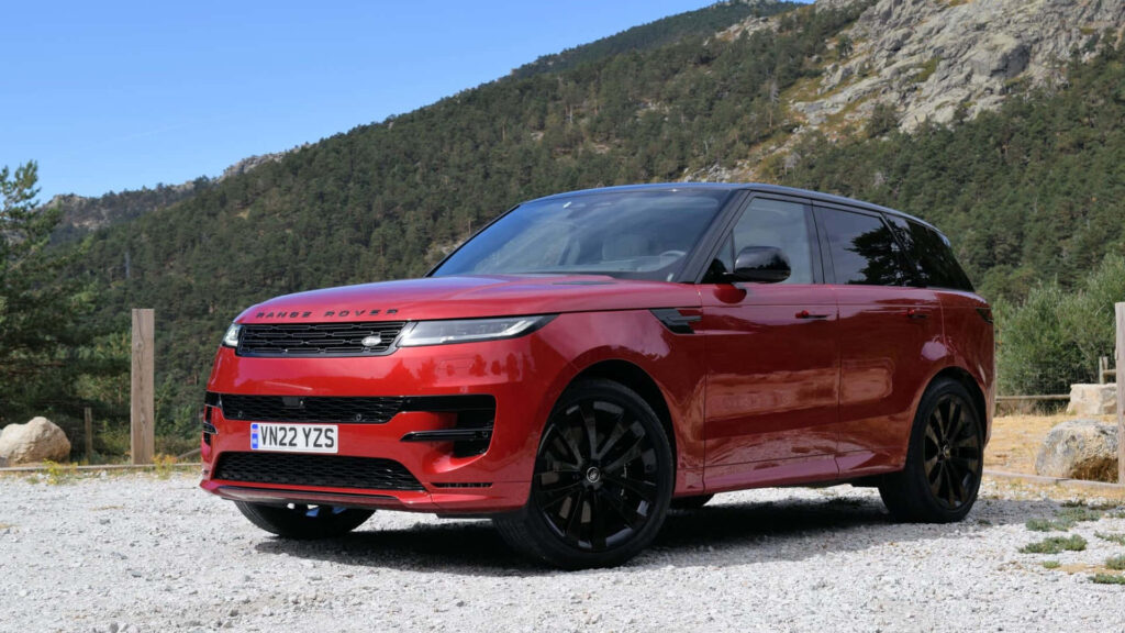 Luxury Red Range Rover Wallpaper: Power Meets Elegance in Nature