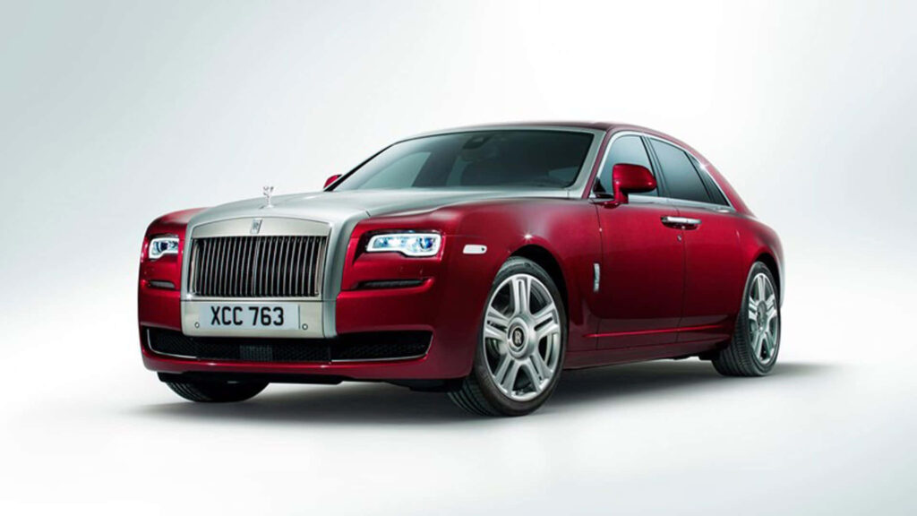 Luxury red Rolls-Royce sedan with elegant design and superior performance wallpaper background