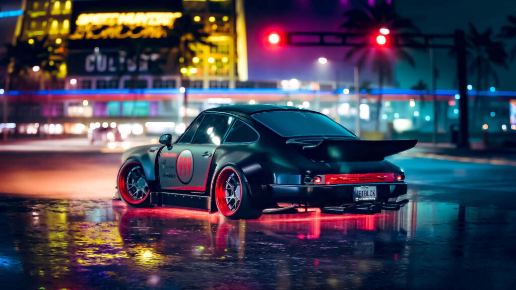 Luxury sports car speeding through neon-lit city streets at night with wet reflective pavement Wallpaper