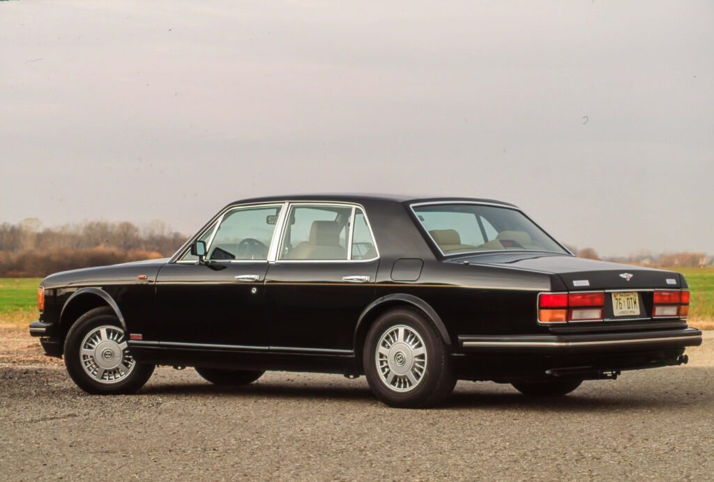 Striking Bentley Turbo R Gliding through the Open Road Wallpaper