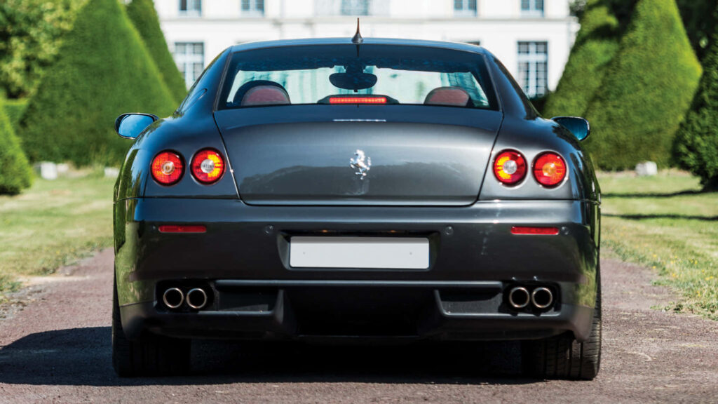 The Red Jewel of Speed and Opulence: Exploring the Ferrari 612 Scaglietti's Unparalleled Performance and Luxurious Aesthetics Wallpaper