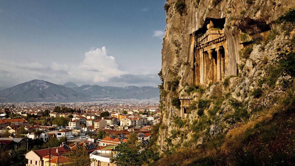 Lycian Rock-Cut Tomb Wallpaper: Stunning Cliffside View in Turkey