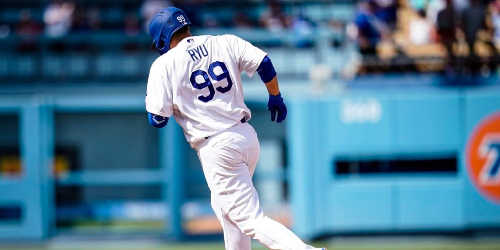MLB pitcher Ryu Hyun-jin in Dodgers uniform throwing pitch in bright stadium wallpaper background