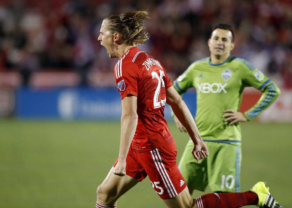 MLS playoff action with FC Dallas Walker Zimmerman celebrating against Seattle Sounders player Wallpaper
