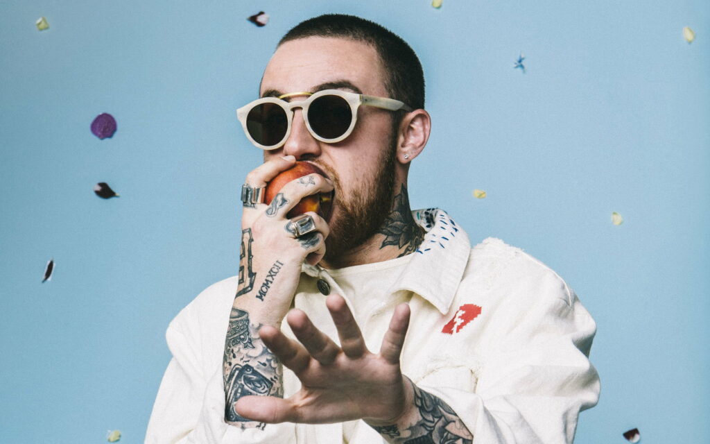 Mac Miller: A Captivating Portrait of a Talented American Rapper and Singer Wallpaper