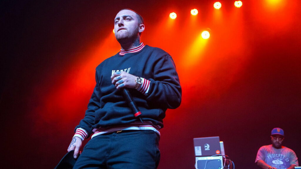 Vibrant Stage Performance: Mac Miller Serenades Surrounded by Celebrities in HD Wallpaper