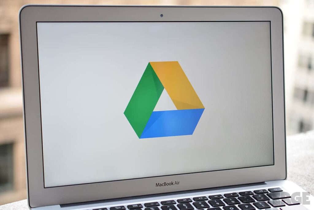 MacBook Air with Google Drive Logo - Blurred Outdoor Wallpaper