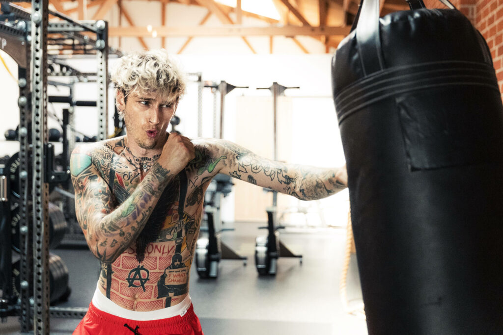 Machine Gun Kelly: Gym Training with Tattoos & Punching Bag Wallpaper