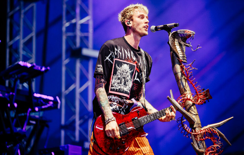 Machine Gun Kelly Live: Passionate Guitar Performance Wallpaper