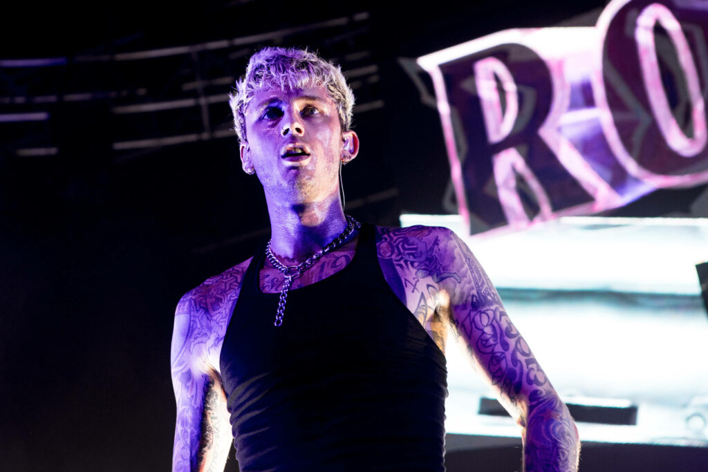 Machine Gun Kelly Live: Intense Performance & Tattoos Wallpaper