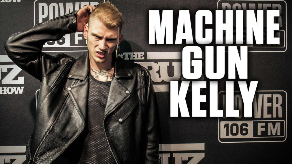 Machine Gun Kelly in Stylish Leather Jacket Against Radio Logos Wallpaper