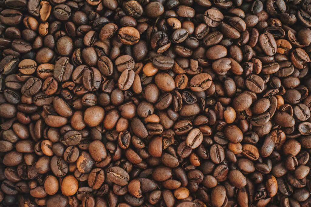 Macro Coffee Beans Wallpaper: Textured Brown Earthy Background