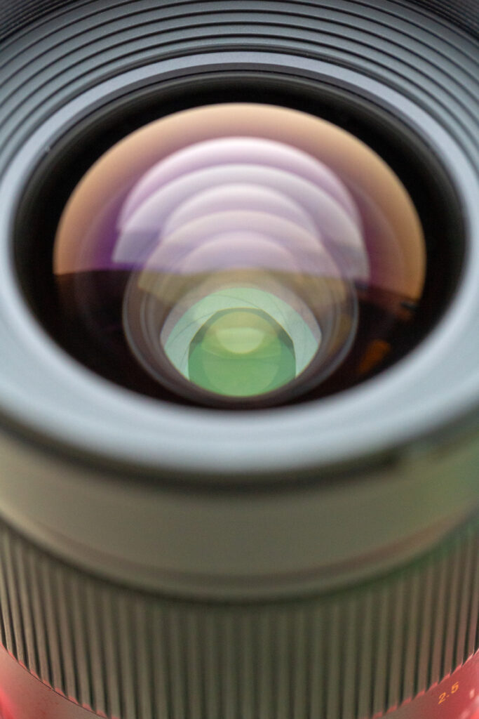 Macro Close-Up of Camera Lens: Intricate Glass Details Wallpaper
