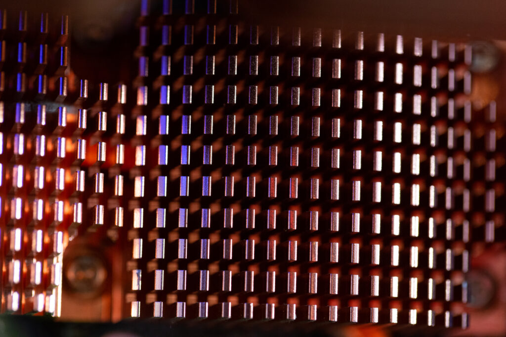 Intricate Metallic Radiator Fins: Close-Up Macro Wallpaper Background