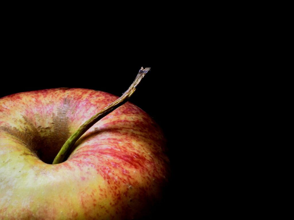 Ripe Red Apple Macro Shot on Black Background - Stunning Wallpaper
