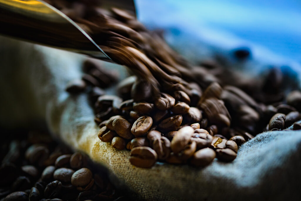 Close-Up Macro: Coffee Beans in Motion - Textured Wallpaper Background