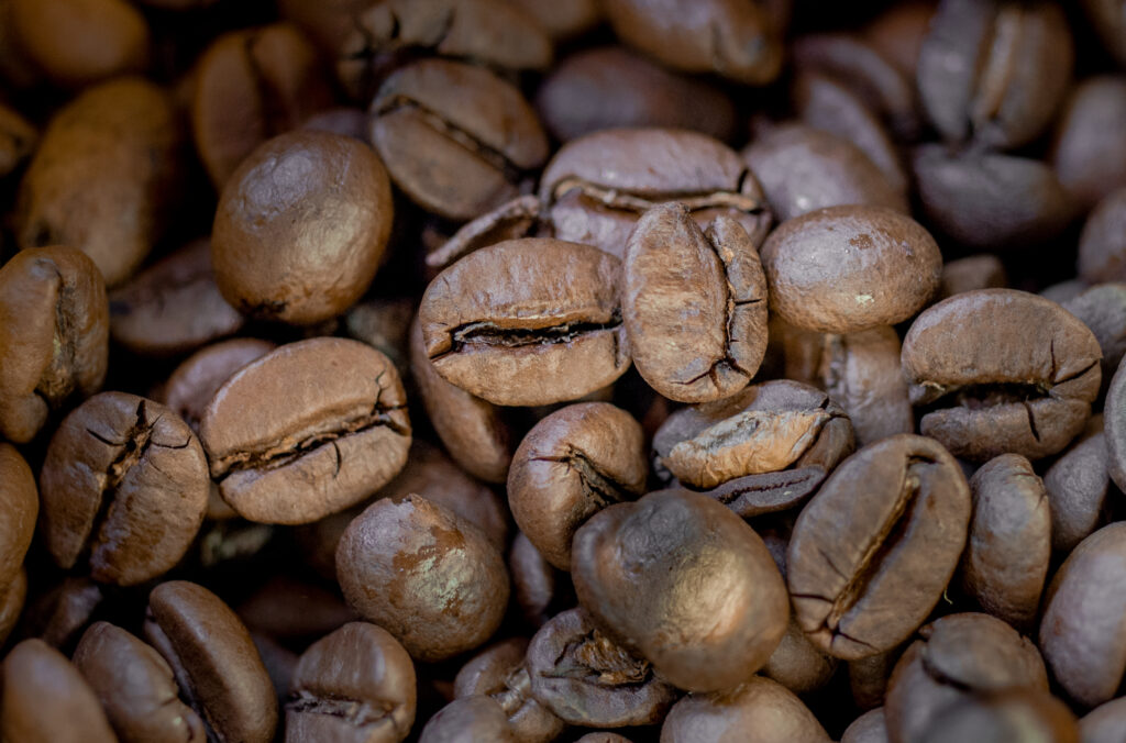 Macro Coffee Beans Wallpaper: Rich Texture & Earthy Tones Background