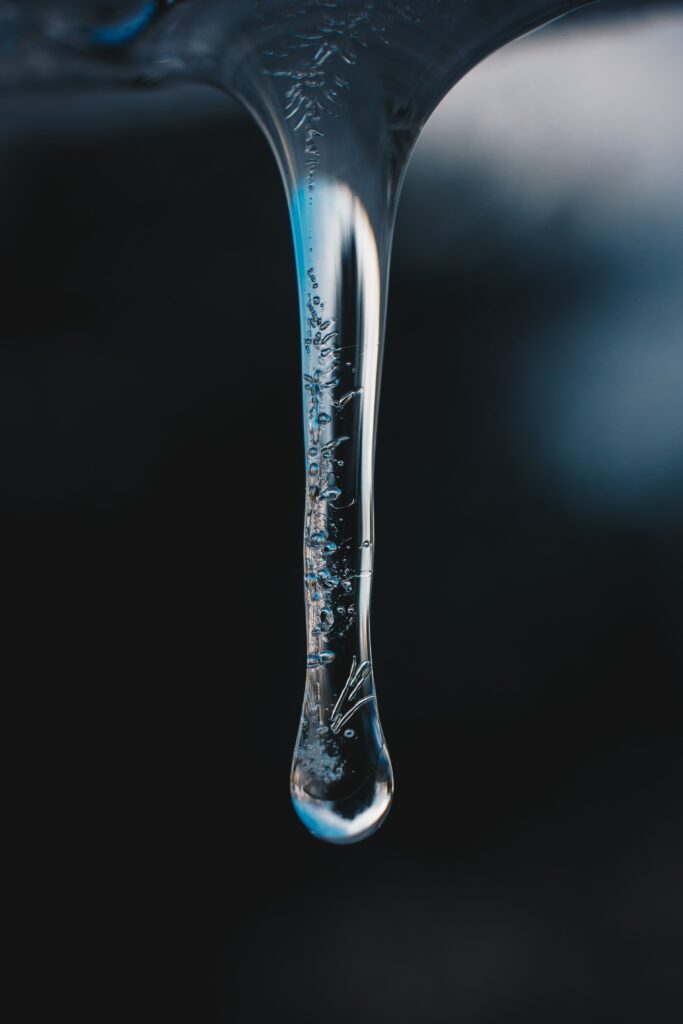 Macro Ice Droplet with Frost Patterns - Dark Wallpaper Background
