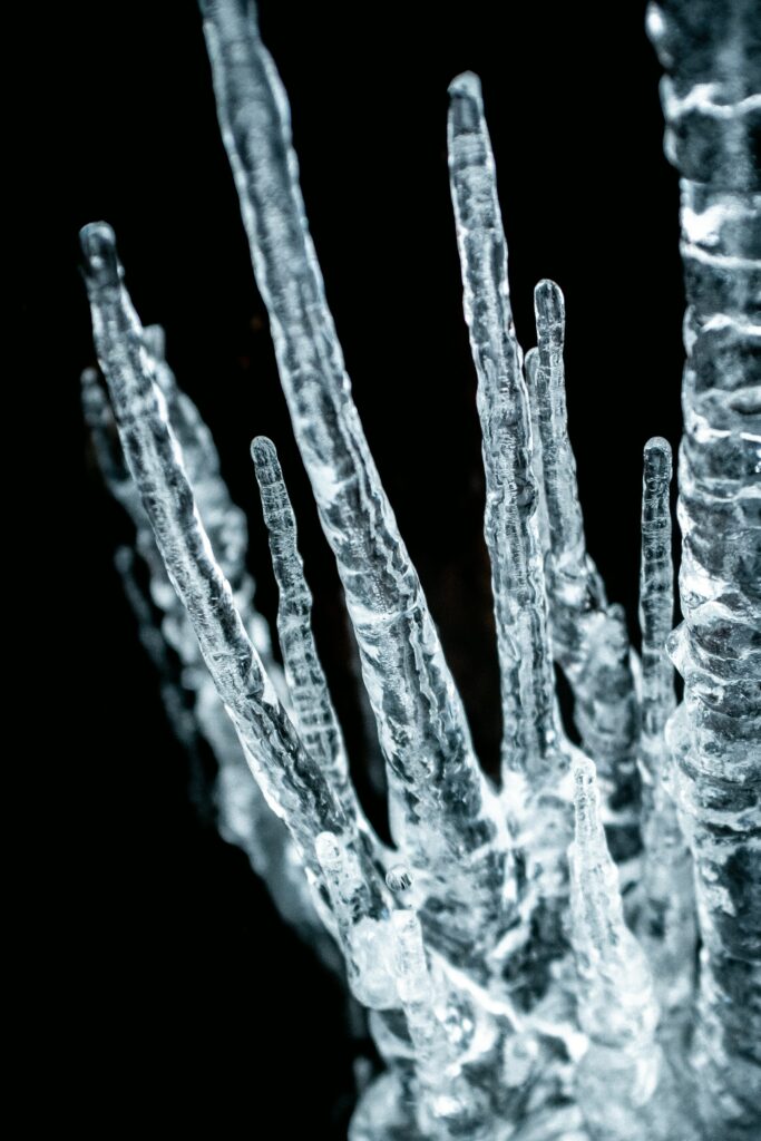 Macro Ice Wallpaper: Intricate Frozen Textures on Dark Background