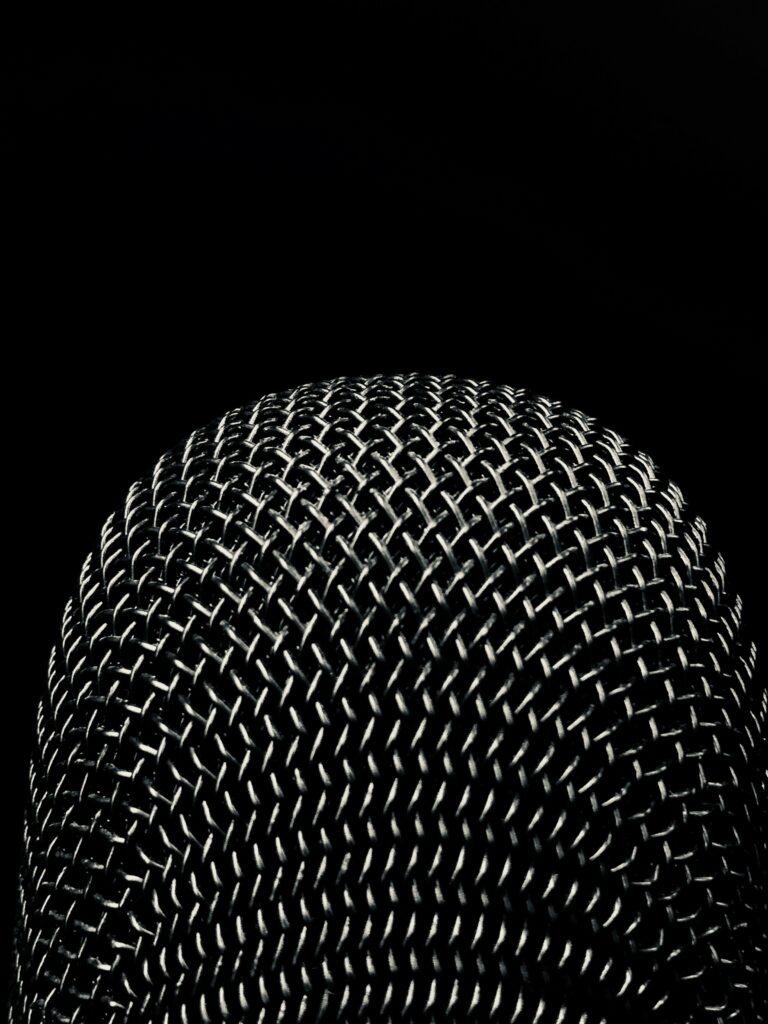 Moody Microphone Wallpaper: Intricate Macro Design on Dark Background