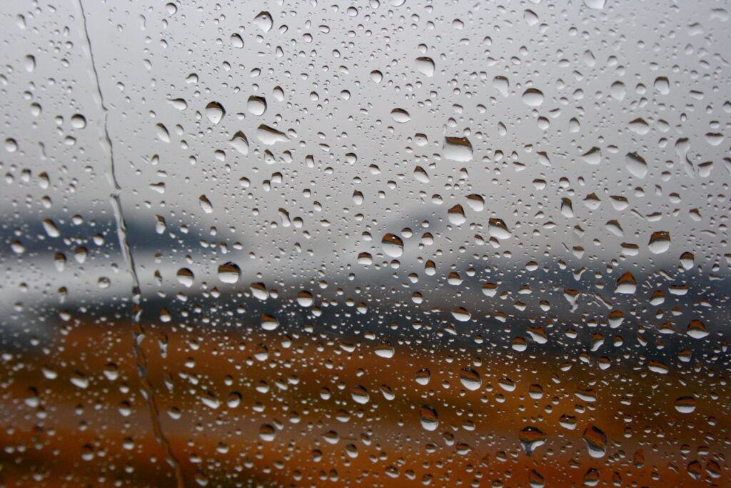 Macro Rain Droplets on Glass: Stunning Wallpaper Background