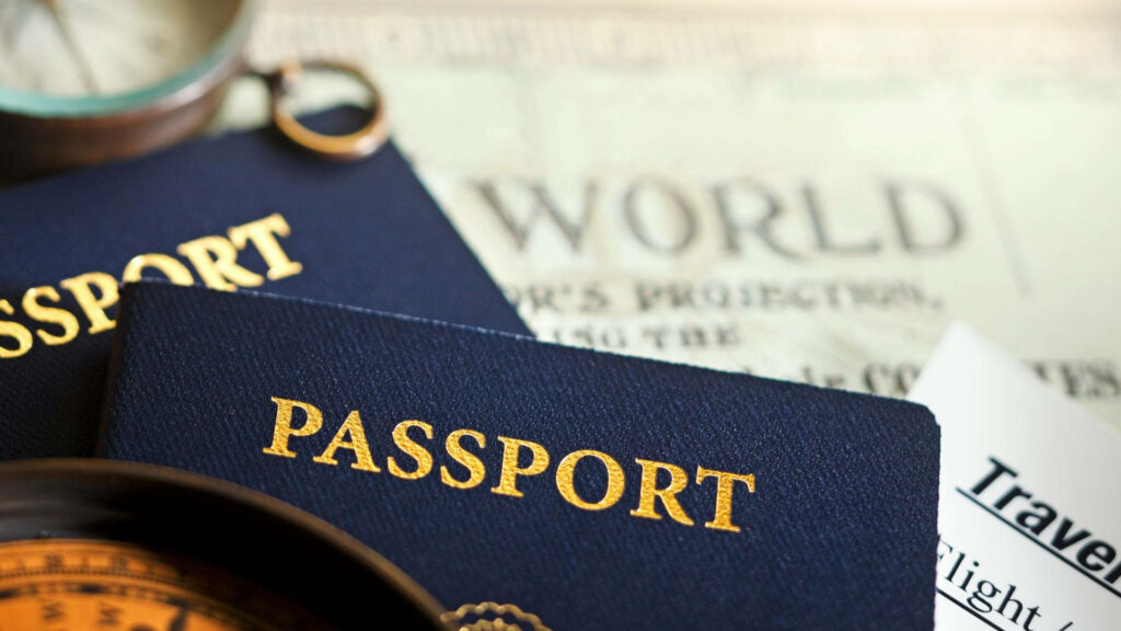 Macro Shot of Blue Passports & Compass: Adventure Wallpaper