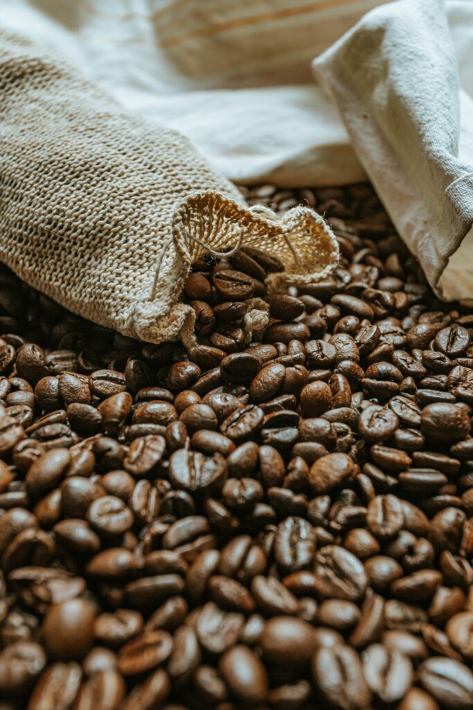Macro Shot of Roasted Coffee Beans in Burlap Bag Wallpaper
