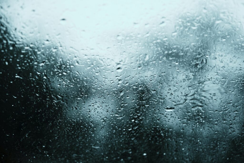 Artistic Water Drop Macro Wallpaper on Blurred Glass Background
