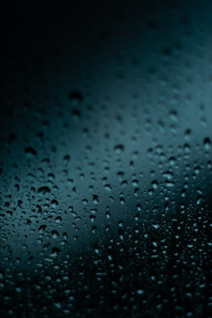 Close-Up Macro Wallpaper: Water Droplets on Dark Surface
