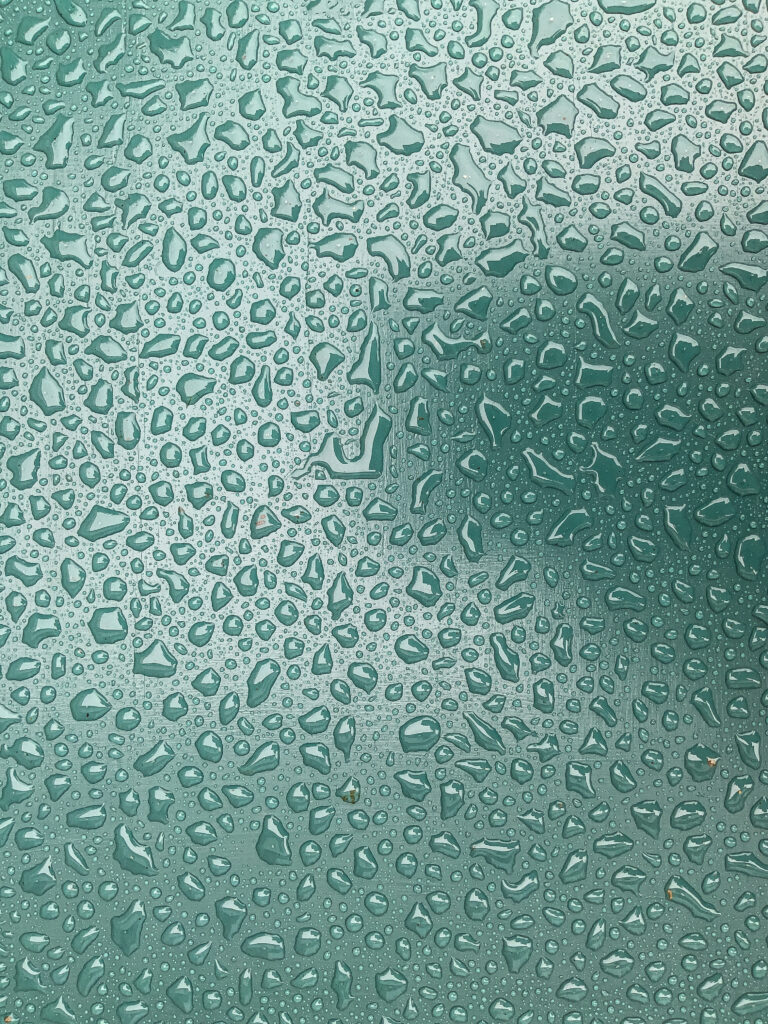 Stunning Macro Water Droplets Wallpaper on Smooth Green Background