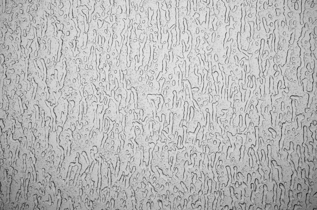 Macro Water Droplets on Grey Glass - Intricate Wallpaper Background