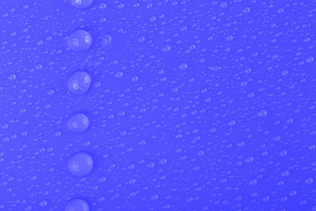 Macro Water Droplets on Blue Surface: Intricate Texture Wallpaper